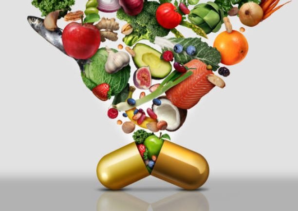 Vitamin dietary supplement as a capsule with fruit vegetables nuts and beans inside a nutrient pill as a natural medicine health treatment with 3D illustration elements.