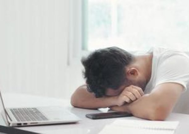 the-employee-is-sitting-stressed-out-with-his-job-free-photo